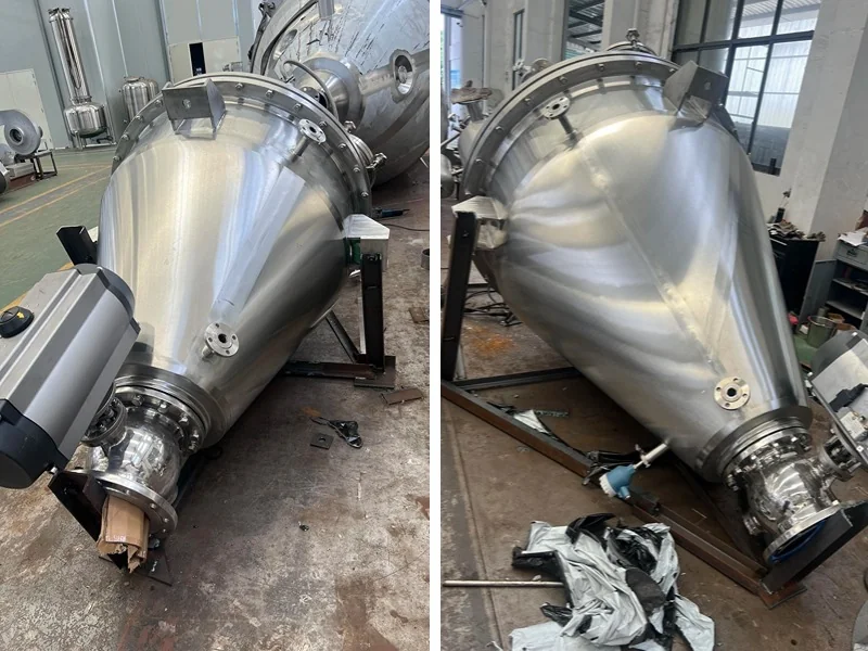 Two views of a fabricated conical vacuum dryer vessel in the workshop