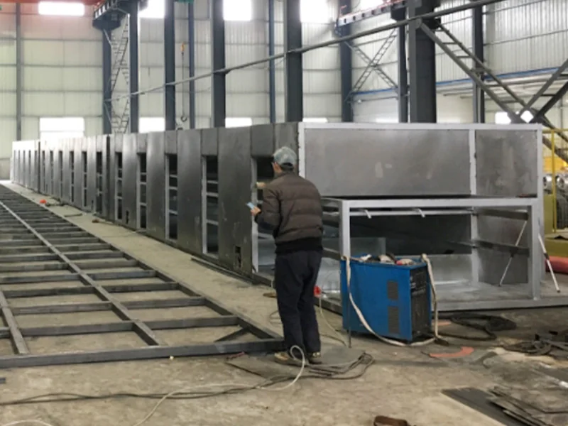 Long conveyor dryer assembly with stainless steel drying chambers in the workshop