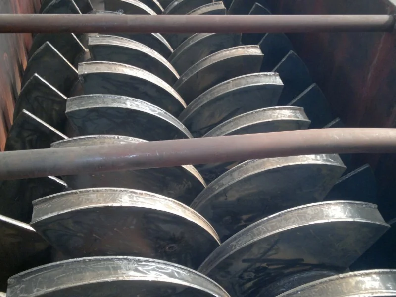 Close-up of the intermeshing paddle arrangement inside a twin-shaft dryer