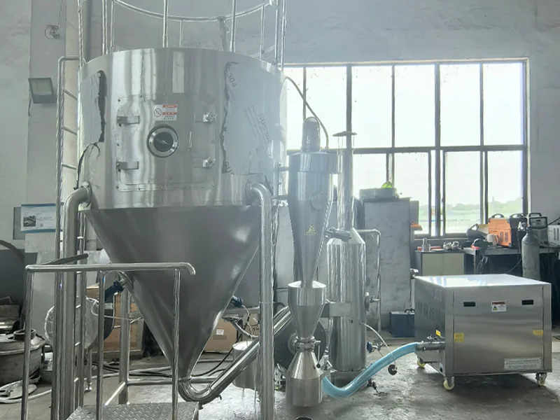 Laboratory spray drying system with wet scrubbing and cooled pneumatic conveying equipment