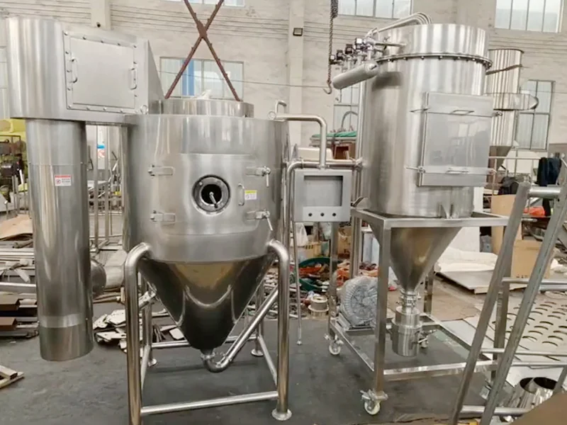 Laboratory spray dryer with a front inspection port and adjacent cyclone separator