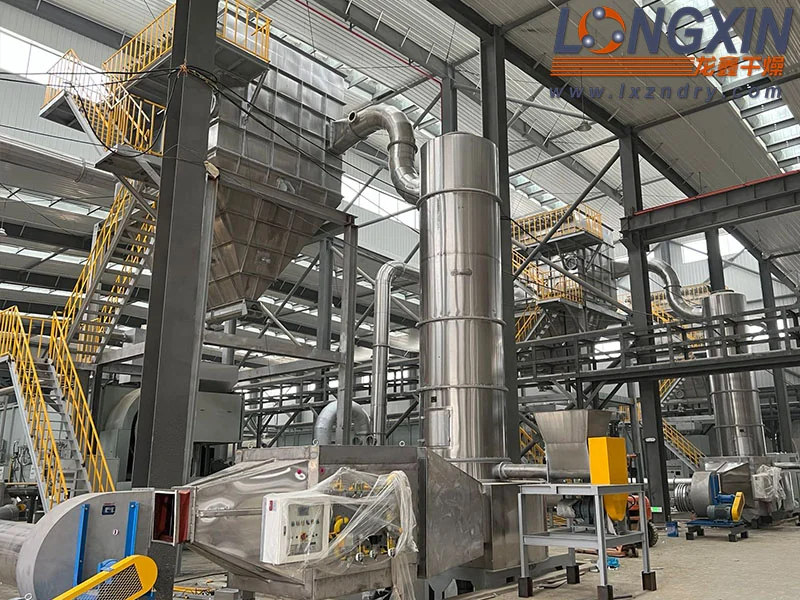Installed XSG spin flash dryer with stainless steel drying chamber and connected ductwork