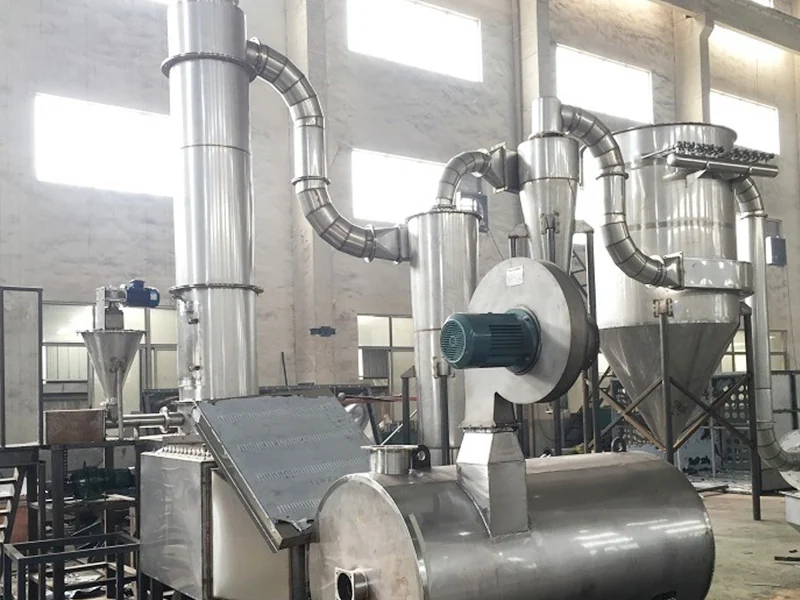 Closed-loop spin flash drying installation with connected process vessels