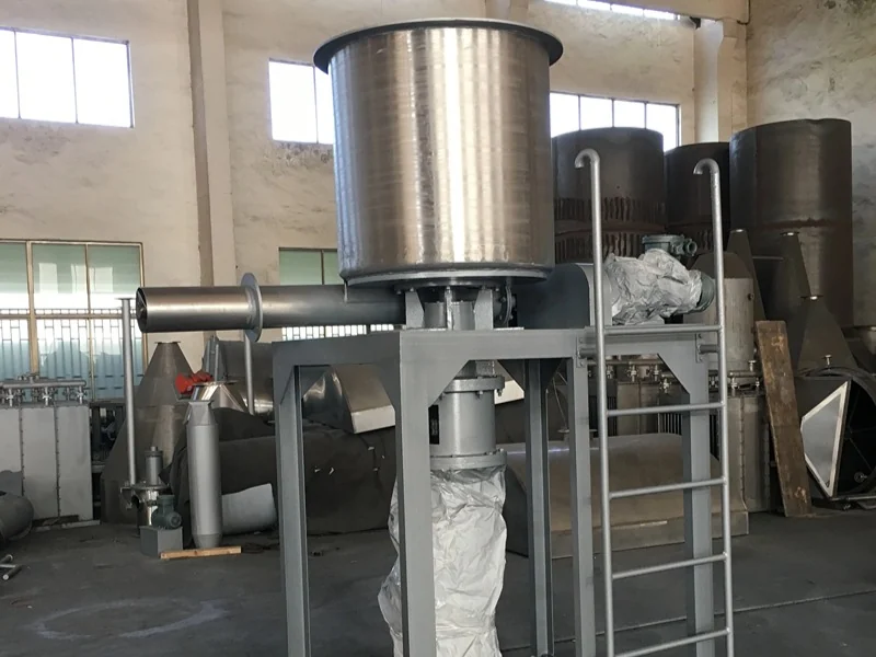 Forced-feed assembly for delivering material to a spin flash dryer