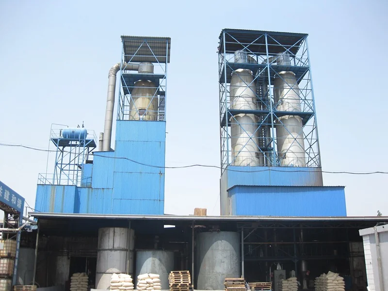 DF spray drying installation with multiple towers above a blue-clad production building