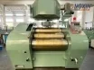 Front view of a YS400 hydraulic three-roll mill with an overhead feed tipper