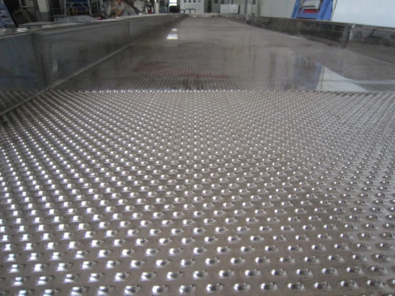 Close-up of the air distributor plate at the feed end of a vibrating fluid bed