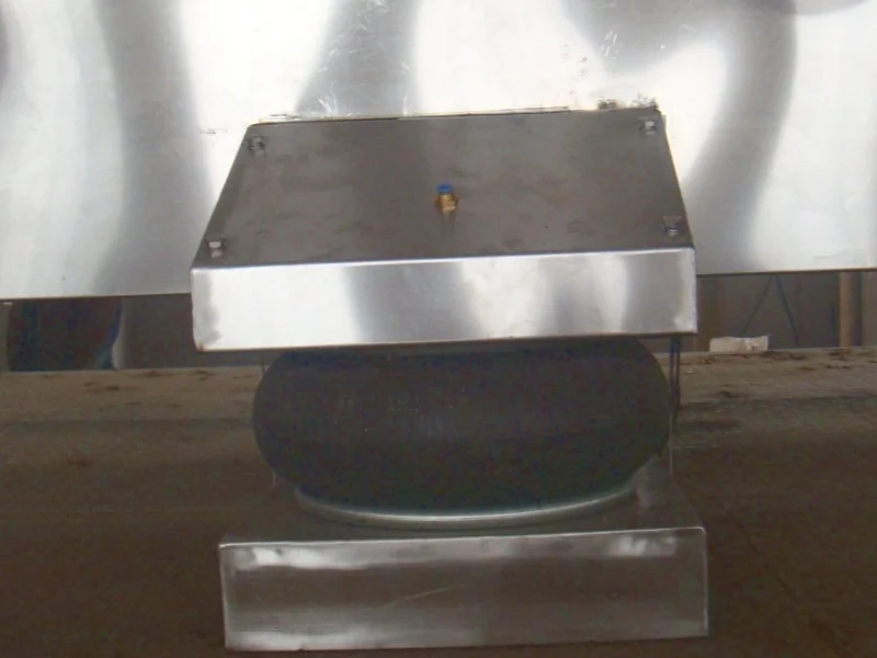 Air-spring vibration isolator beneath the vibrating fluid bed housing