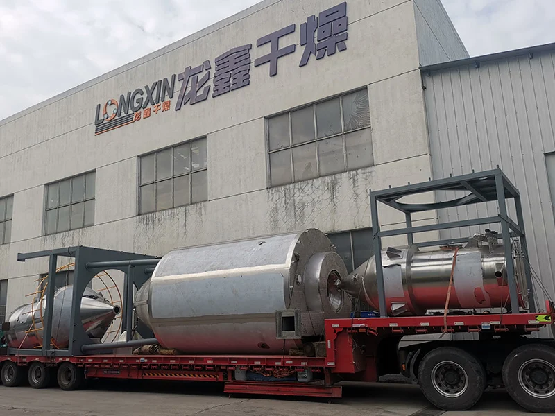 QPG fluid nozzle spray drying equipment with atomizer and drying chamber.