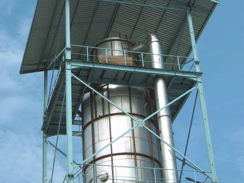 Pressure spray drying tower for a coffee production line beneath a roof
